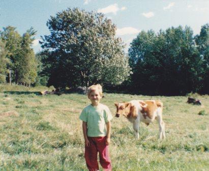 Young Calf and Child on High Meadows Farm